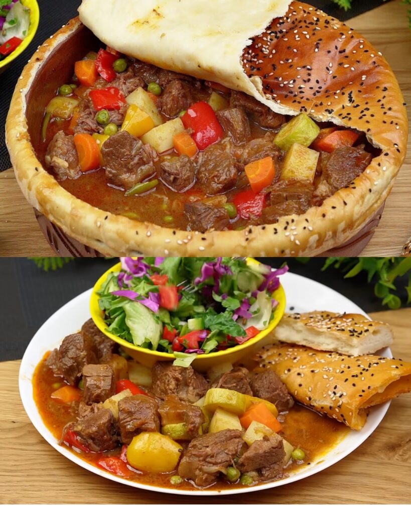 Rustic Meat Stew in a Pottery Dish with Freshly Baked Bread and Garden Salad finished dish
